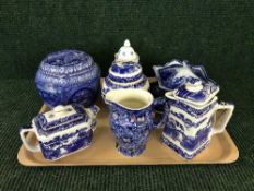 A tray of blue and white miniature tureen, assorted Ringtons china, caddies,