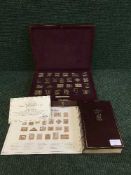 A cased silver proof stamp set: The Empire Collection, 25 gold-plated silver ingots,