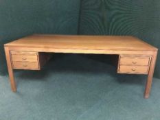 A mid 20th century teak writing desk fitted four drawers
