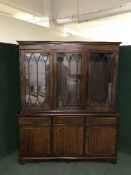 An inlaid mahogany triple door bookcase