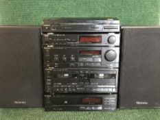 A Technics five piece separates system with speakers and remote