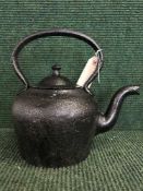 A cast metal kettle