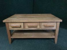 A contemporary coffee table fitted three drawers