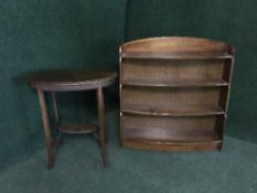 A set of open shelves and an Edwardian kidney shaped occasional table