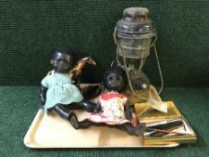 A tray of tilley lamp, two plastic dolls, metal animals,