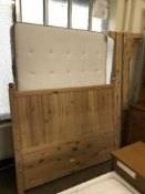 An Ikea 4'6 pine bed frame with mattress