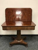A Victorian mahogany tea table