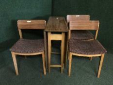 A mid 20th century five piece melamine dining room suite