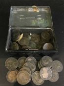 A tin containing a quantity of English coins;