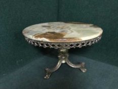 A coffee table on gilt metal base