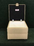 A cream vinyl footstool - withdrawn from sale