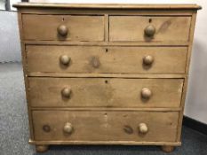 A Victorian pine five drawer chest