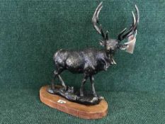 A cast metal figure - Stag on wooden base