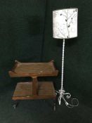 A teak trolley and a metal standard lamp