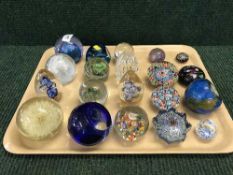 A tray of twenty glass paperweights