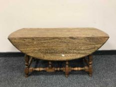 An Ercol elm drop leaf coffee table
