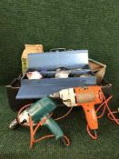 A box of Black & Decker drills, metal tool box,