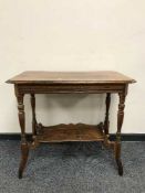 A Victorian oak two tier occasional table