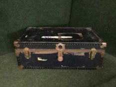 A metal bound travelling trunk