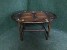 A rectangular mahogany butler's tray on stand