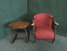 An early 20th century oak armchair and an occasional table