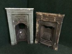 Two antique cast iron fire inserts