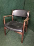 A mid 20th century teak framed armchair