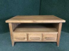 A contemporary coffee table fitted three drawers