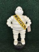 A cast metal figure - Michelin man