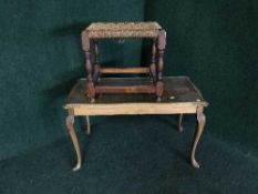 A walnut glass topped table together with an oak rush seated stool