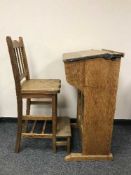 An early 20th century oak school desk with oak stepped high stool
