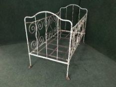 An antique metal child's cot