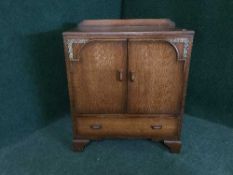 An oak linen cupboard fitted a drawer