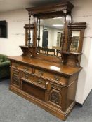 An impressive late Victorian oak mirror backed sideboard