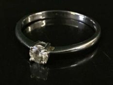 A 9ct white godl diamond solitaire ring, the diamond weighing 0.