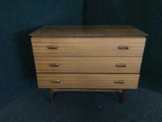 A mid 20th century teak three drawer chest
