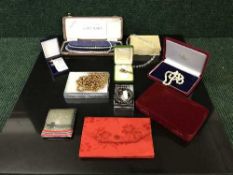 A set of three small continental pins in bronze, silver and 18ct gold,