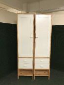Two white and pine storage cupboards fitted drawers