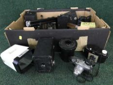 Three boxes of assorted cameras,