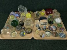 Two trays of glass paperweights