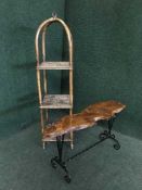 A rustic pine log table and a bamboo and wicker what not stand