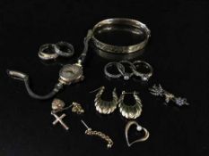 A collection of gilt metal jewellery, bar brooch, rolled gold bangle,