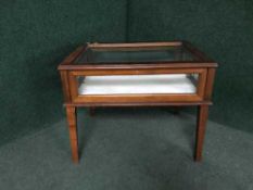 A mahogany curio table