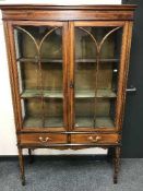 An Edwardian inlaid mahogany display cabinet