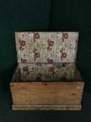An antique stripped pine blanket box