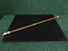 A cane mounted by solid silver cast of a fox's head inscribed Belford 26th September 1842