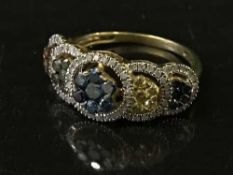A gold ring set with various coloured diamonds, 3.
