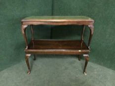 An mahogany glass and leather topped coffee table and one other