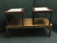 A rosewood copper topped coffee table and pair of lamp tables
