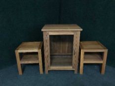 A contemporary oak audio cabinet and a pair of oak lamp tables